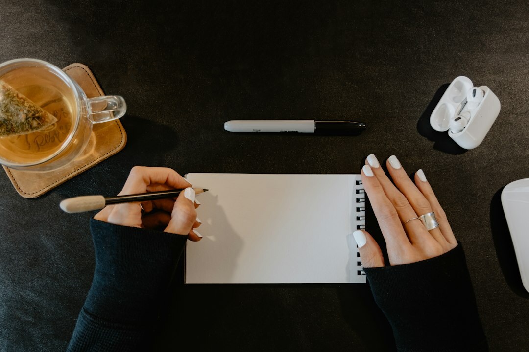 writer at desk with notebook